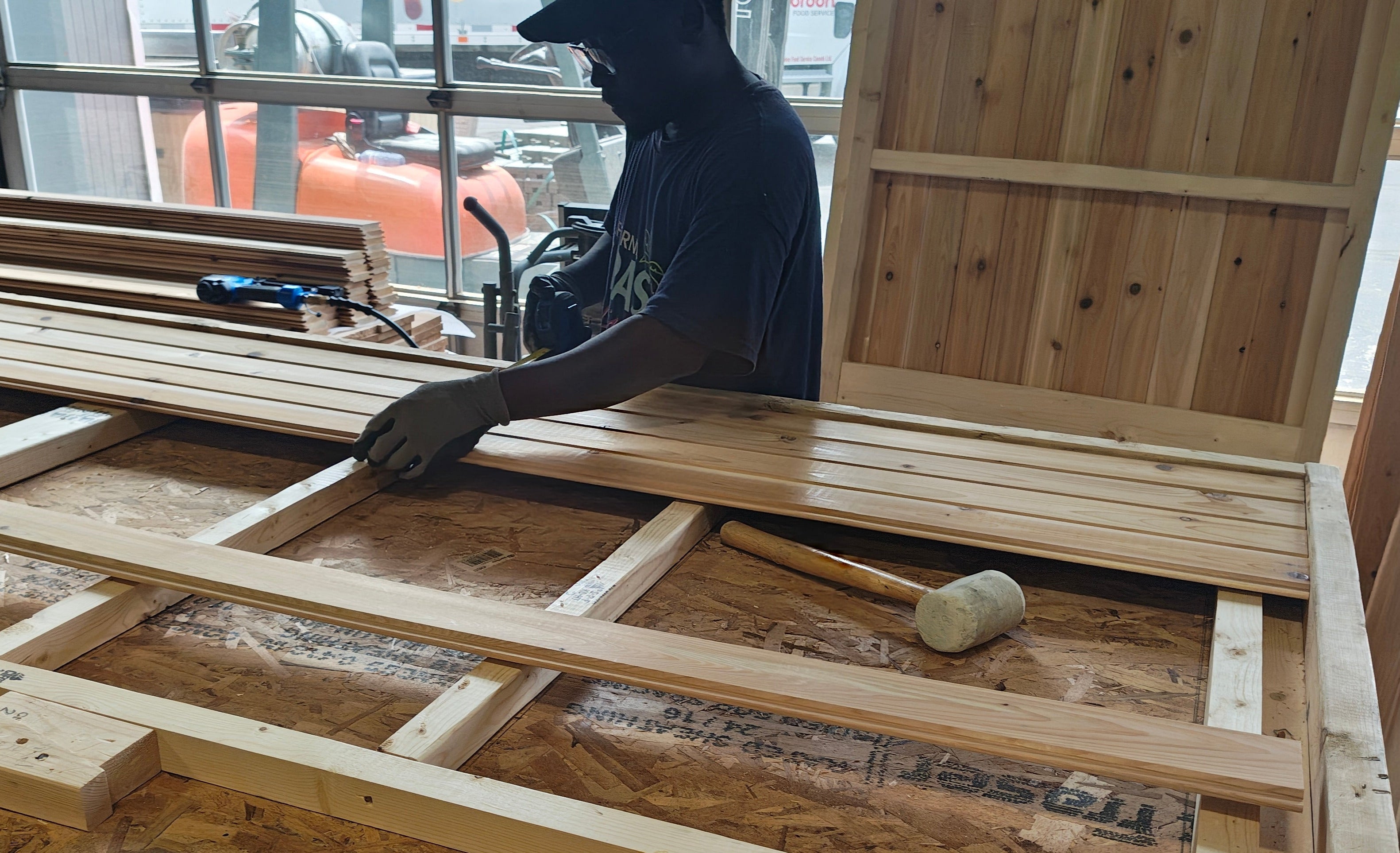 team member building the outside paneling 